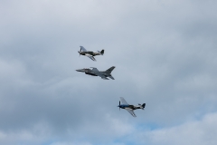 F-16 and Two P-51s Flying Formation